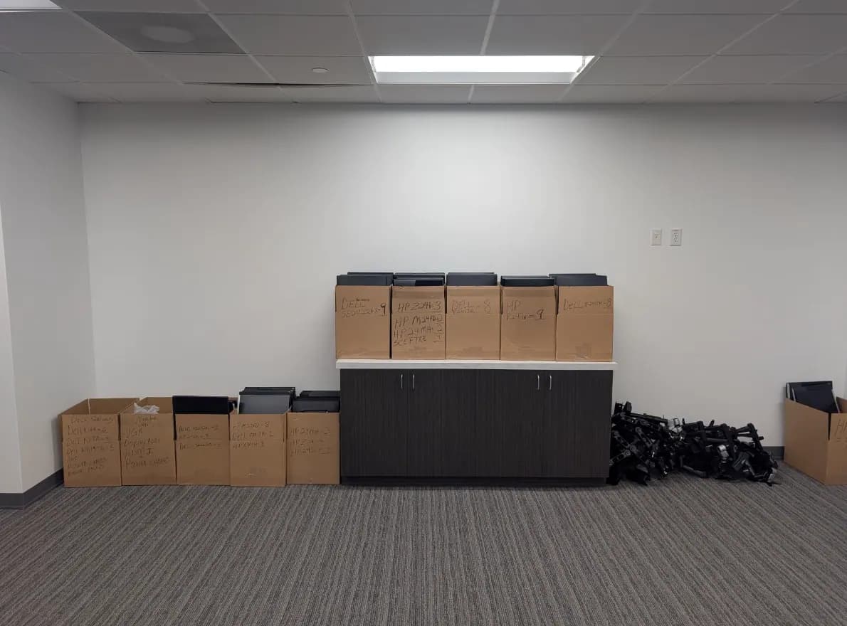 Office boxes and equipment staged before an industrial relocation